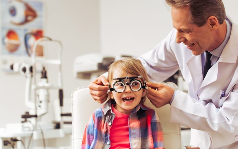 Children smiling and wearing glasses after an eye test at Portsea Island Eyecare